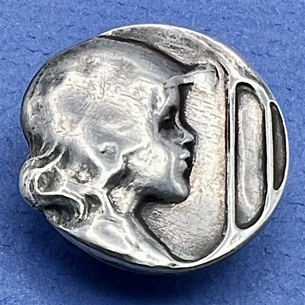 Kate Harris’s Arts & Crafts Hallmarked silver button of child’s head