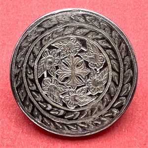 A 19th c. Steel button with cross and flowers.