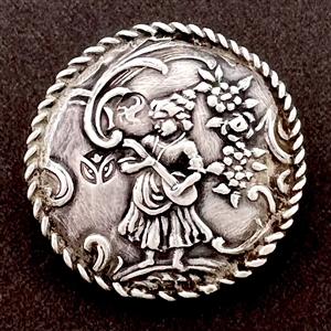 Hallmarked silver button of a musician playing.