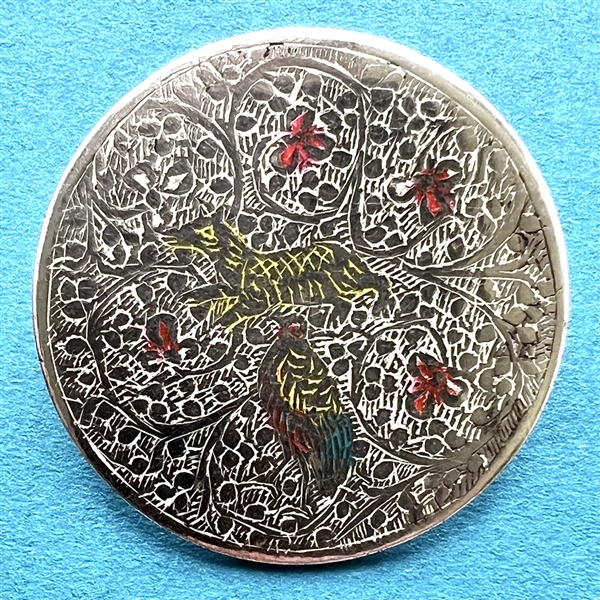 Persian button of a bird and an animal among flowers.