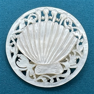 Bethlehem pearl #16 “Scalloped Shell” button.