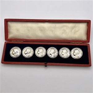 Boxed set of six hallmarked silver buttons of a profile of young girl’s head.