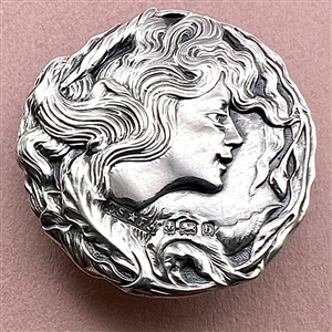 Art Nouveau hallmarked silver button of a woman.