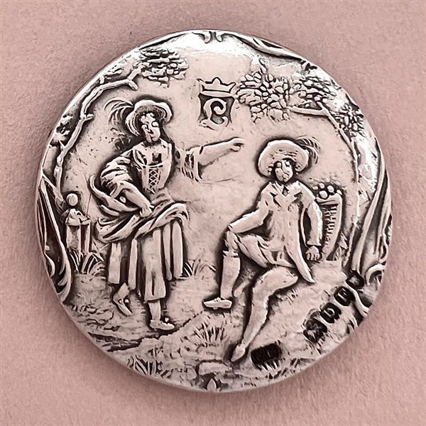 Large hallmarked silver button of man and woman.