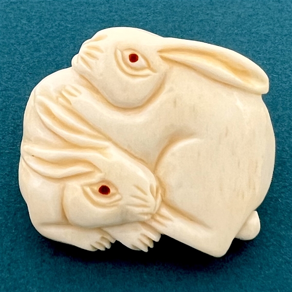 White rabbits Netsuke style natural material button.