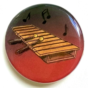 Studio button of xylophone with notes by Shirley Burgess.