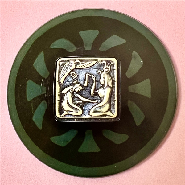 HUGE celluloid tight top button with ivoroid inset of Egyptians.