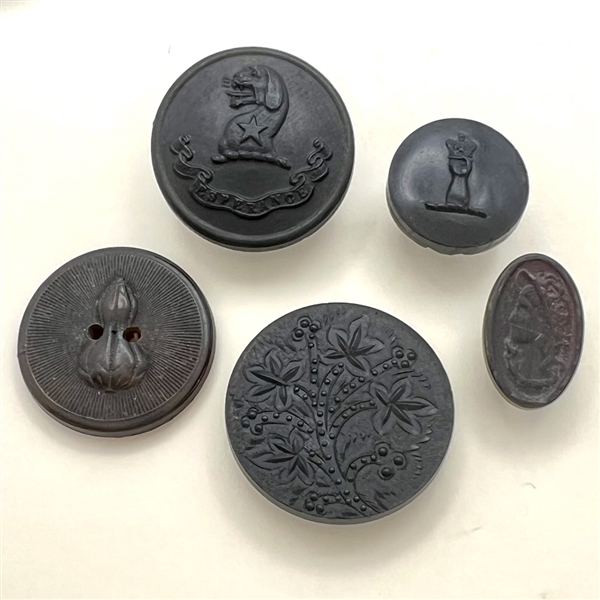 Five molded horn buttons.