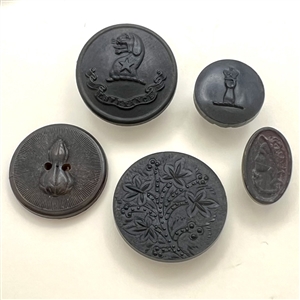 Five molded horn buttons.