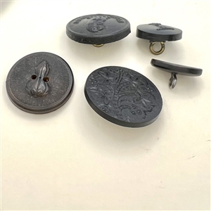 Five molded horn buttons.