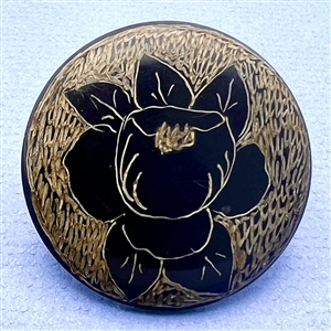 Casein button of a rose with gold. 