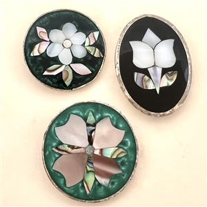 Three Mother of pearl and abalone Mexican inlay buttons of flowers.