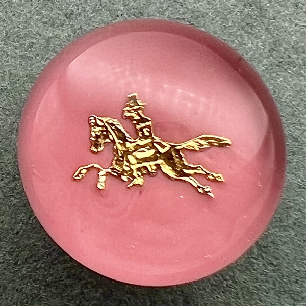 John Gooderham pink paperweight with gold foil horse and rider glass studio button.