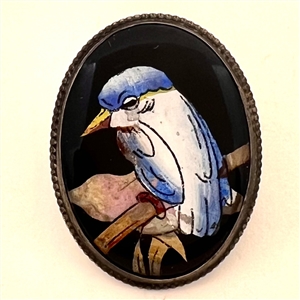 Reverse painted blue bird button