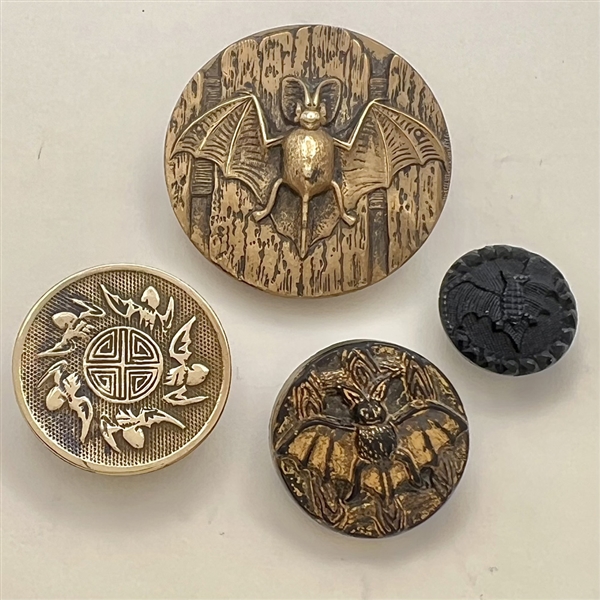 Four fabulous bat buttons.