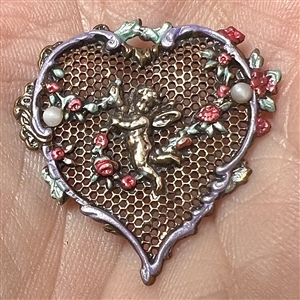 Delicate 19th c. heart shaped enameled screen back button with a cherub.