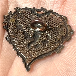 Delicate 19th c. heart shaped enameled screen back button with a cherub.