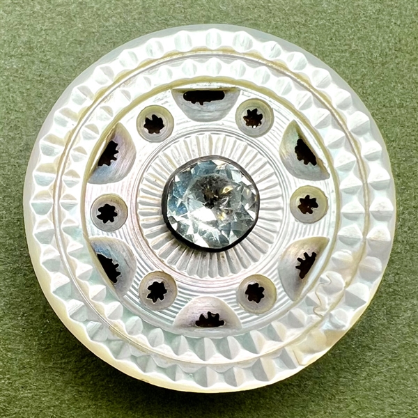 An 18th c. pearl button with openwork and faceted paste pin shank center.