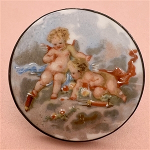 Ceramic button of two cherubs.