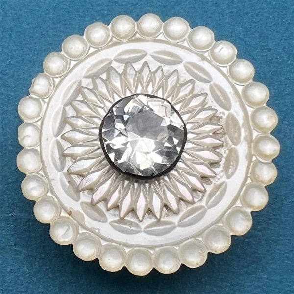 An 18th c. pearl button with pearl and faceted paste pin shank center.