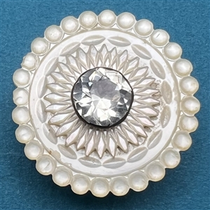 An 18th c. pearl button with pearl and faceted paste pin shank center.