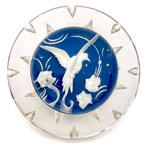 Reverse carved and painted acrylic button of a flying bird.