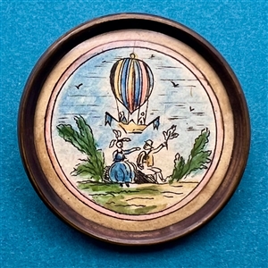 An18th c. hot air balloon - ink and paint on paper under glass button.