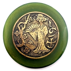 Vintage plastic button with brass of an Asian woman with a fan.