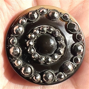 A 19th c. Natural horn button with steels.