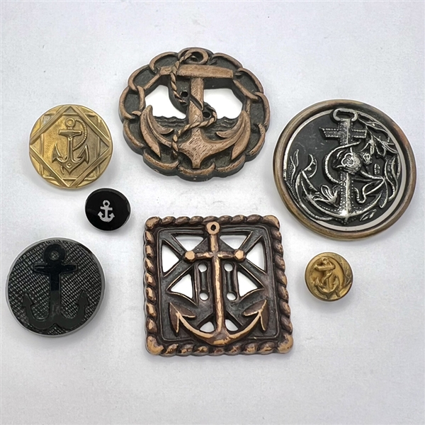 Seven assorted anchor buttons.