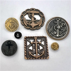 Seven assorted anchor buttons.