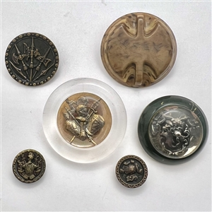 Six assorted weapon and armor buttons. 