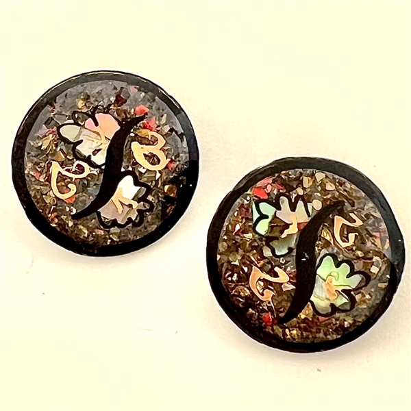 Two exquisite watch crystal buttons. 