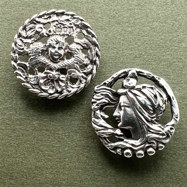 Two hallmarked silver buttons of heads.