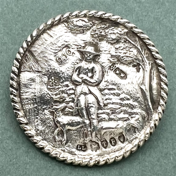 Hallmarked silver button of shepherd and sheep.