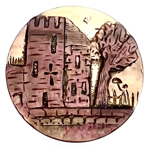 Cameo carved pearl button of a castle.