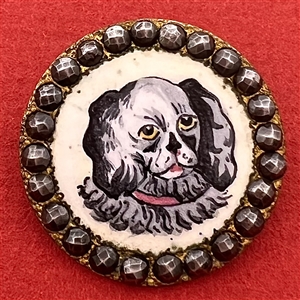 A 19th c. enamel button of a dog with faceted cut steel border.