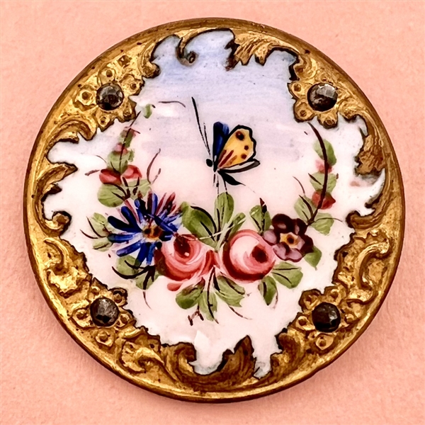 A 19th c. enamel button of flowers and butterfly with Rococo border.