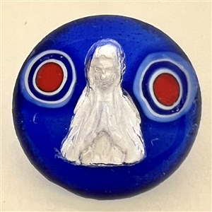 Glass studio paperweight button with sulphide by Theresa Rarig.