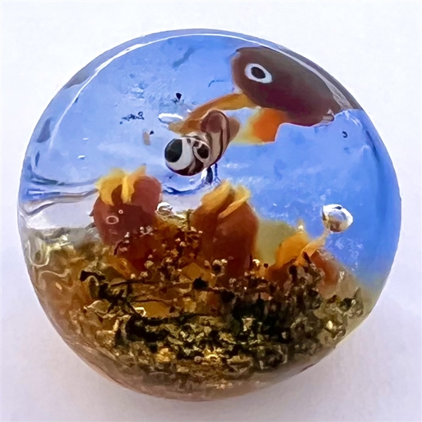 Mary Gaumond’s mother bird feeding it’s young glass studio button.