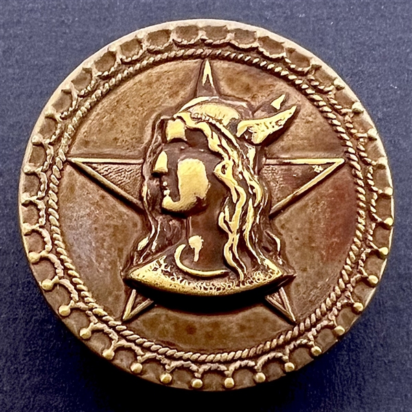 Brass button of Brunnhilda from the opera Valkyrie.