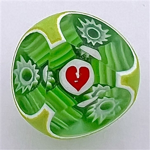 Faceted glass double overlay paperweight “see through”- green with heart studio button by John Gooderham.