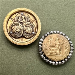 Two coin-like brass buttons of Roman coins.