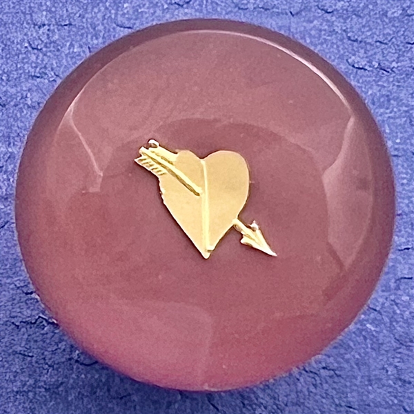 John Gooderham pink paperweight with gold foil heart and arrow glass studio button.