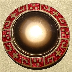 Glass in metal button with an unusual enamel border.