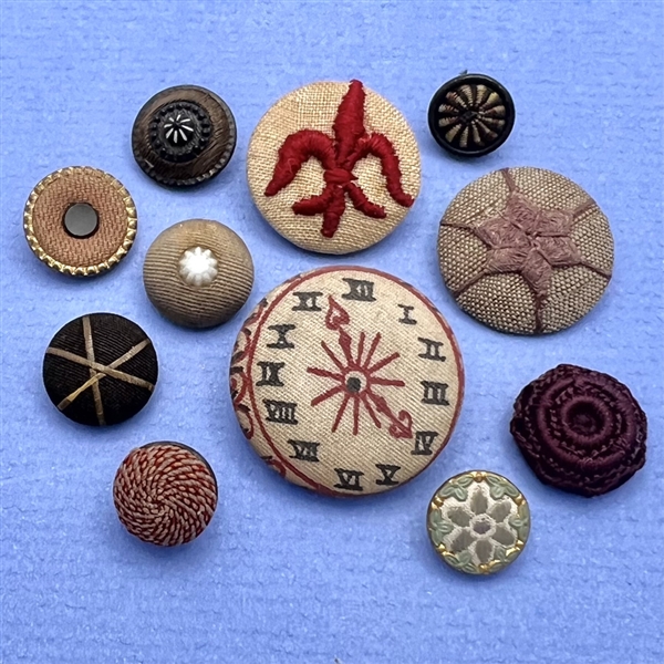 Eleven fabric buttons.