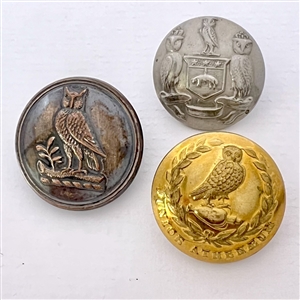 Three assorted owl buttons.