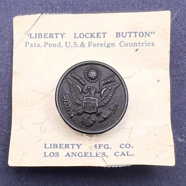 Scarce “Liberty Locket” button on original card.