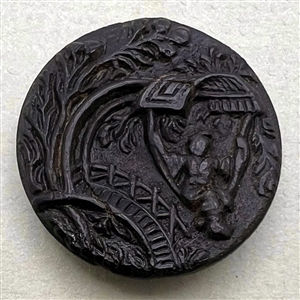 Horn button of a woman swinging in a garden.