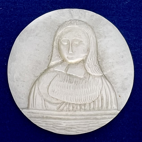 Hand-carved pearl button of a woman by Golbert.